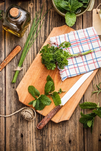 Fresh herbs on cutting board